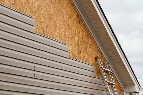 Professional Storm Damage Siding Repair technician working in Marblehead, MA